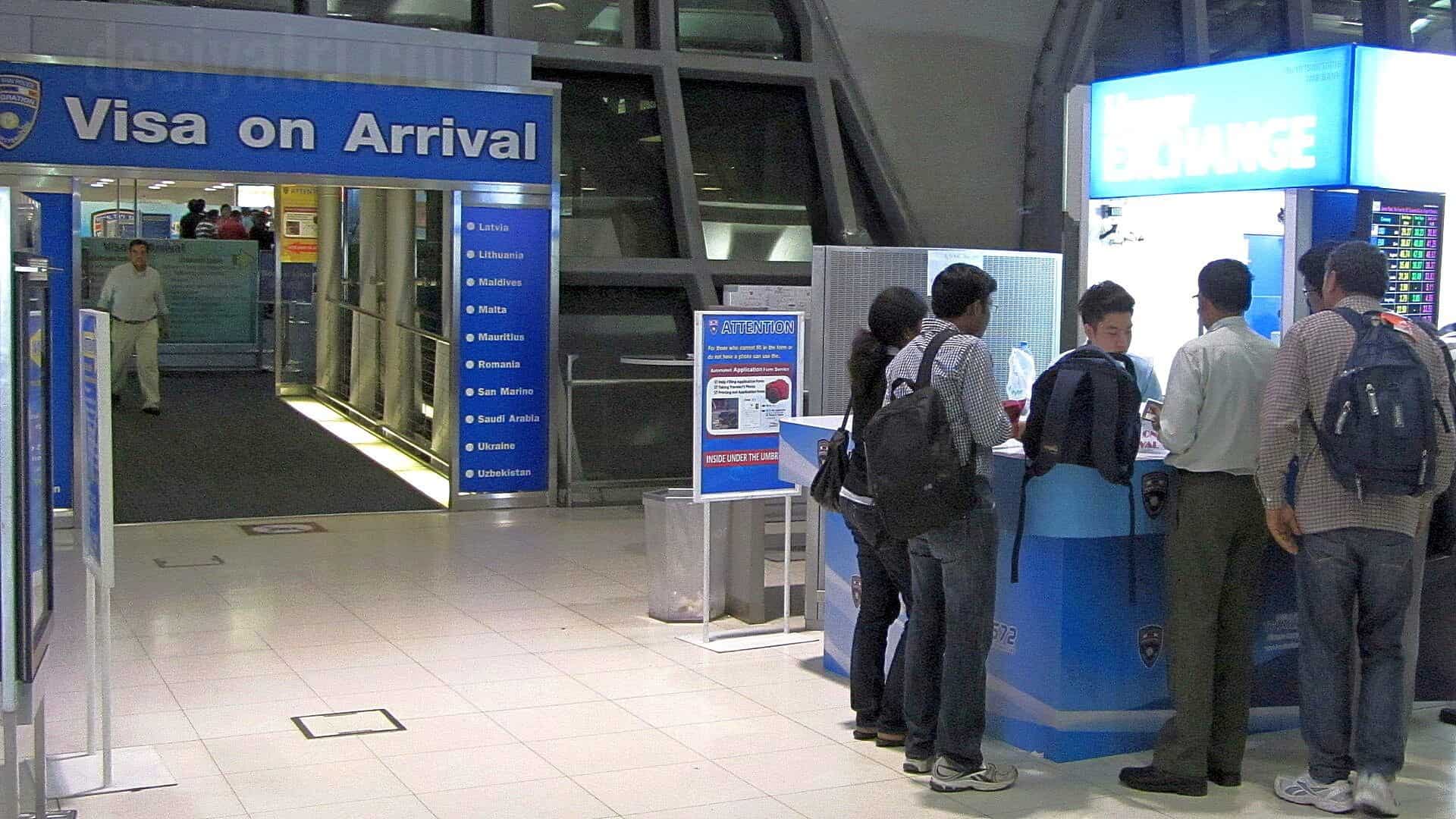 Travelers waiting at the Visa on Arrival counter at Suvarnabhumi Airport in Bangkok